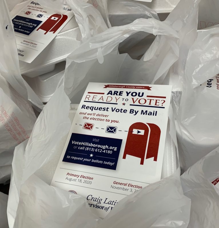 Take-out food orders, each with a vote-by-mail flyer