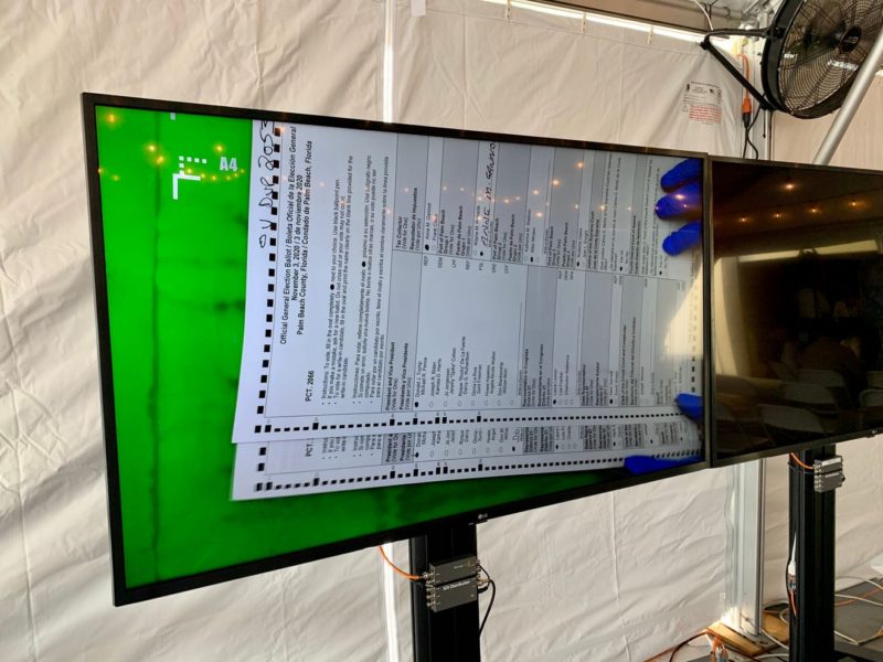 A TV screen displaying a marked ballot. 