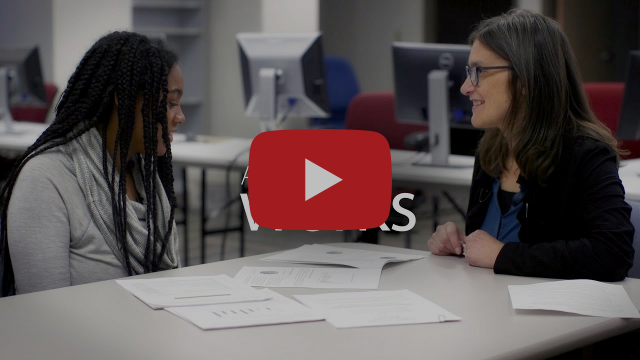 A video of an election official sitting with a student poll worker.