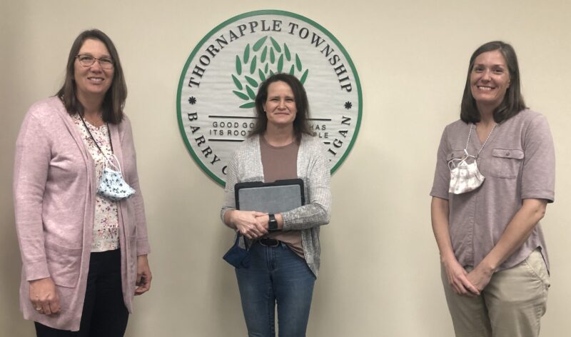 Three women from the Thornapple election office pose for a photo.
